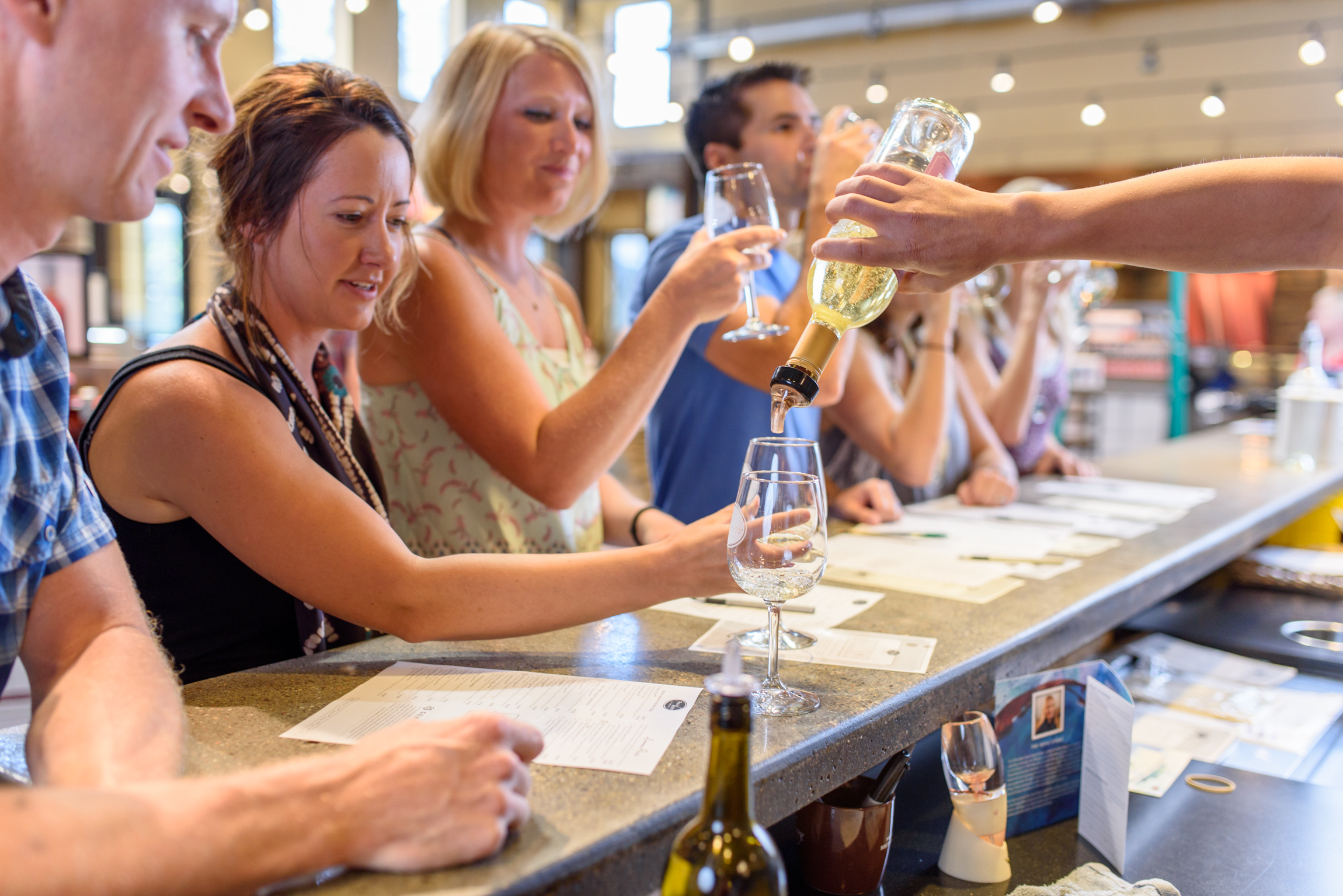 A group enjoys a free wine tasting at Prairie Berry Winery near Hill City, South Dakota.