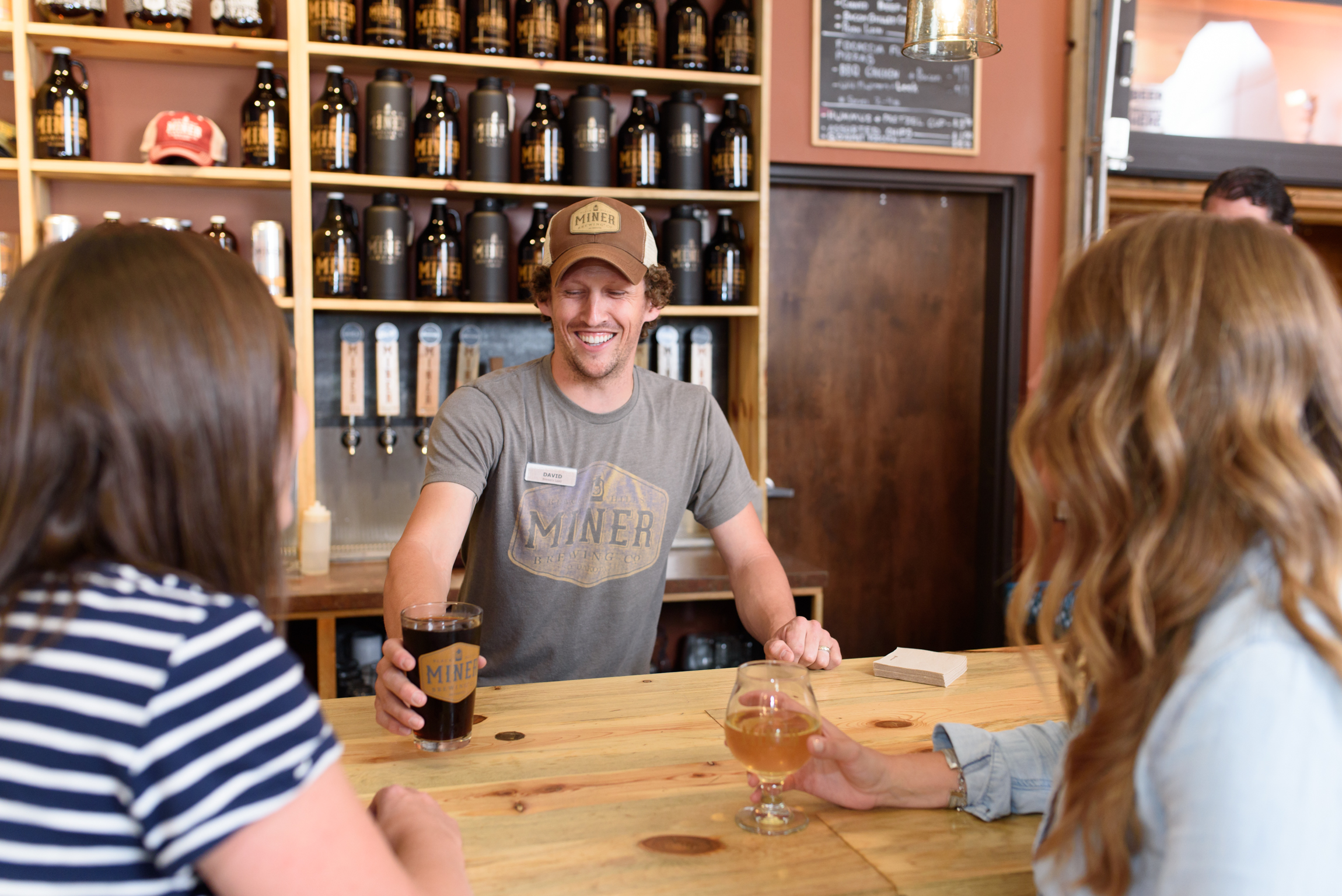 Guests enjoy a pint of beer at Miner Brewing Company near Hill City, South Dakota.